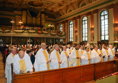 Priests gather during St. John Neumann's feast day Mass